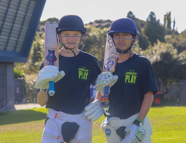 Two boys ready to play cricket